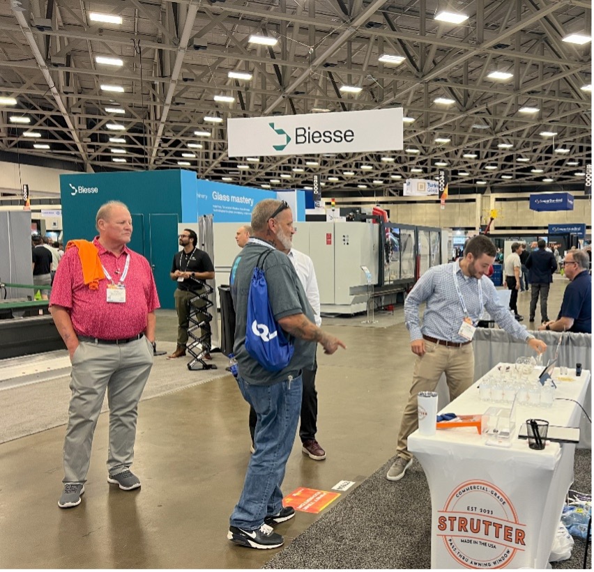 attendees at the Strutter Booth at GlassBuild America 2024